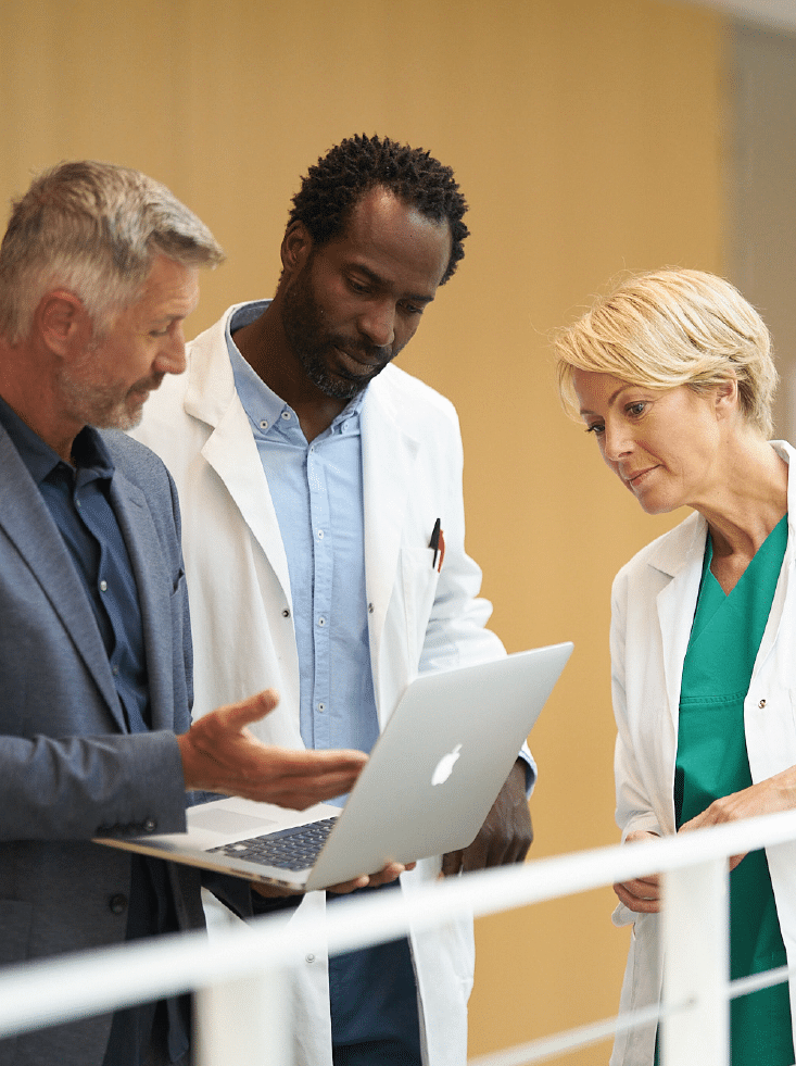 Molecular-Imaging-three-people-checking-laptop Molecular-Imaging-three-people-checking-laptop