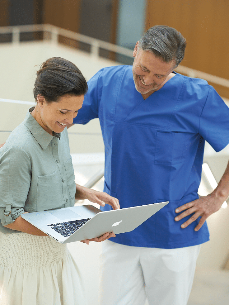 Molecular-Imaging-woman-man-checking-laptop Molecular-Imaging-woman-man-checking-laptop